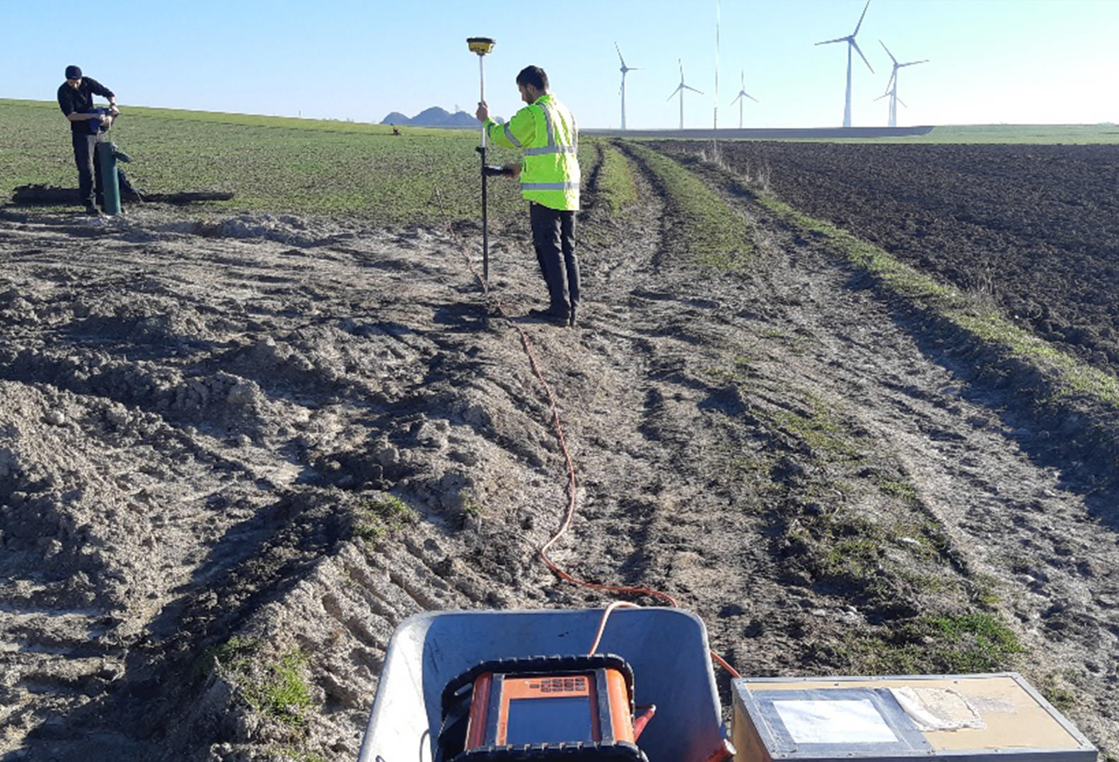 Two men performing a hydrogeological study of an aquifer