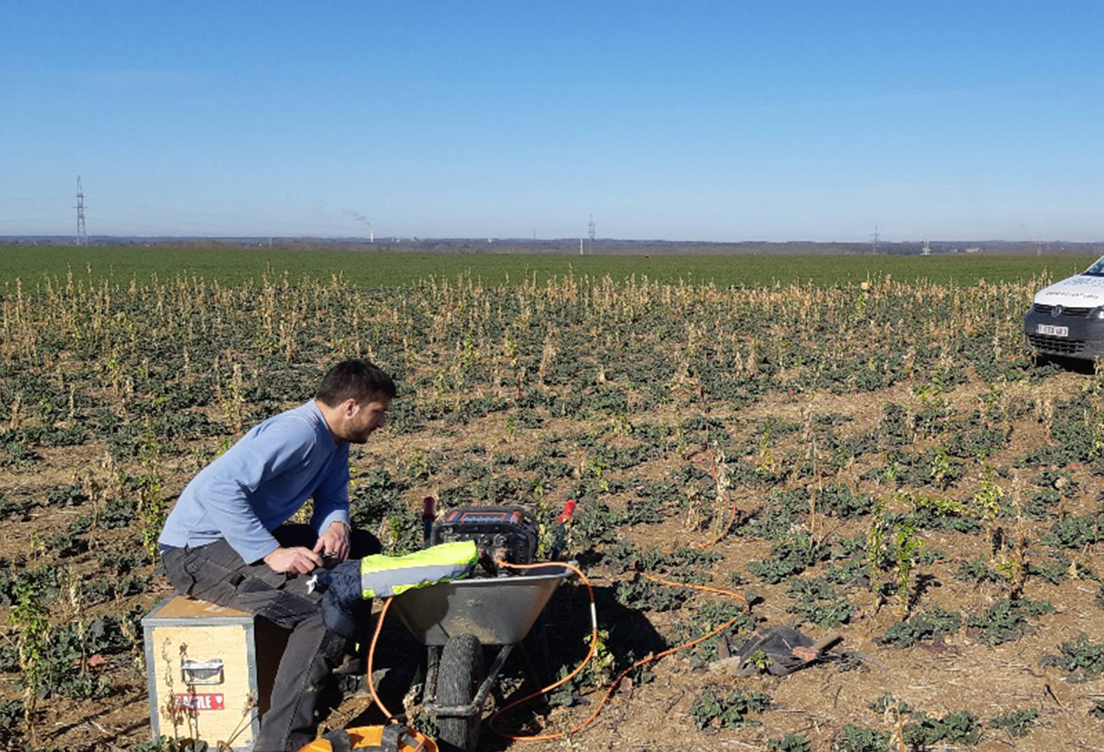 Man performs Geophysical Data Acquisition in Belgium field