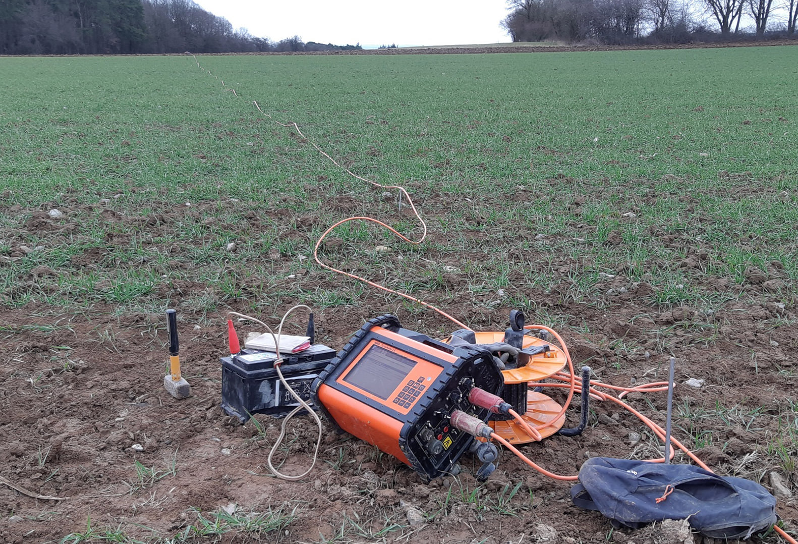 Instrument used for geophysical acquisition pictured on grass patch