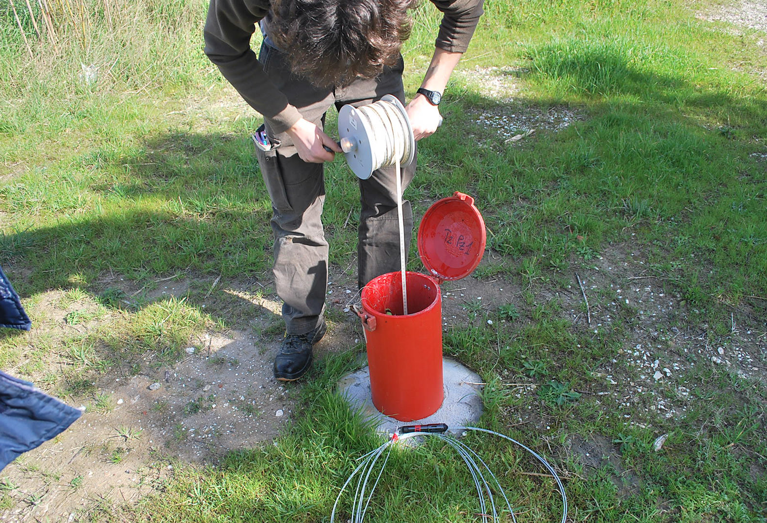 Man uses piezometer in Italy